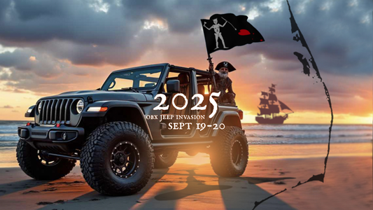 Jeep Wrangler on Outer Banks beach with pirate flag at sunset – OBX Jeep Invasion 2025