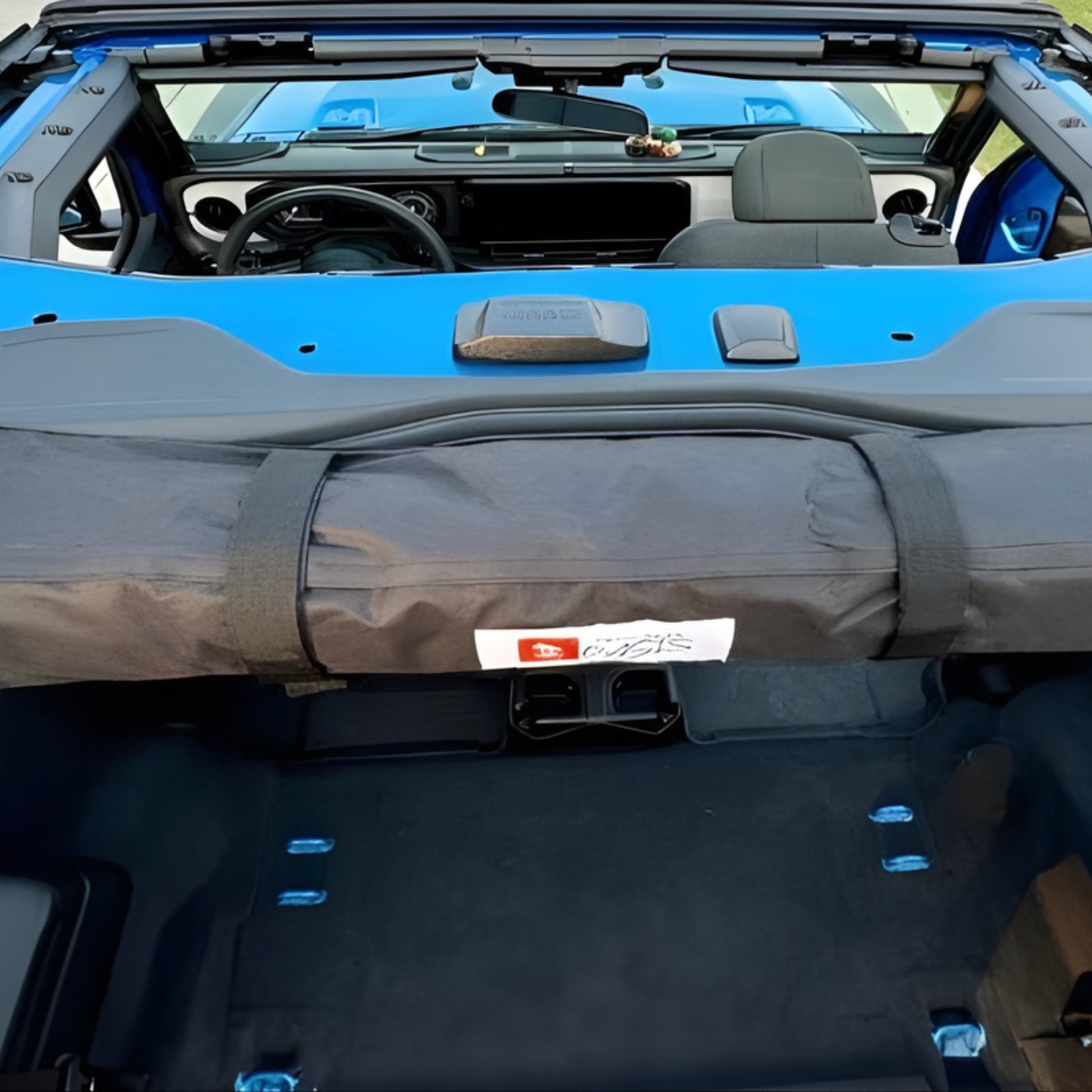 2-in-1 trail cover packed and stored inside 2-door Jeep Wrangler