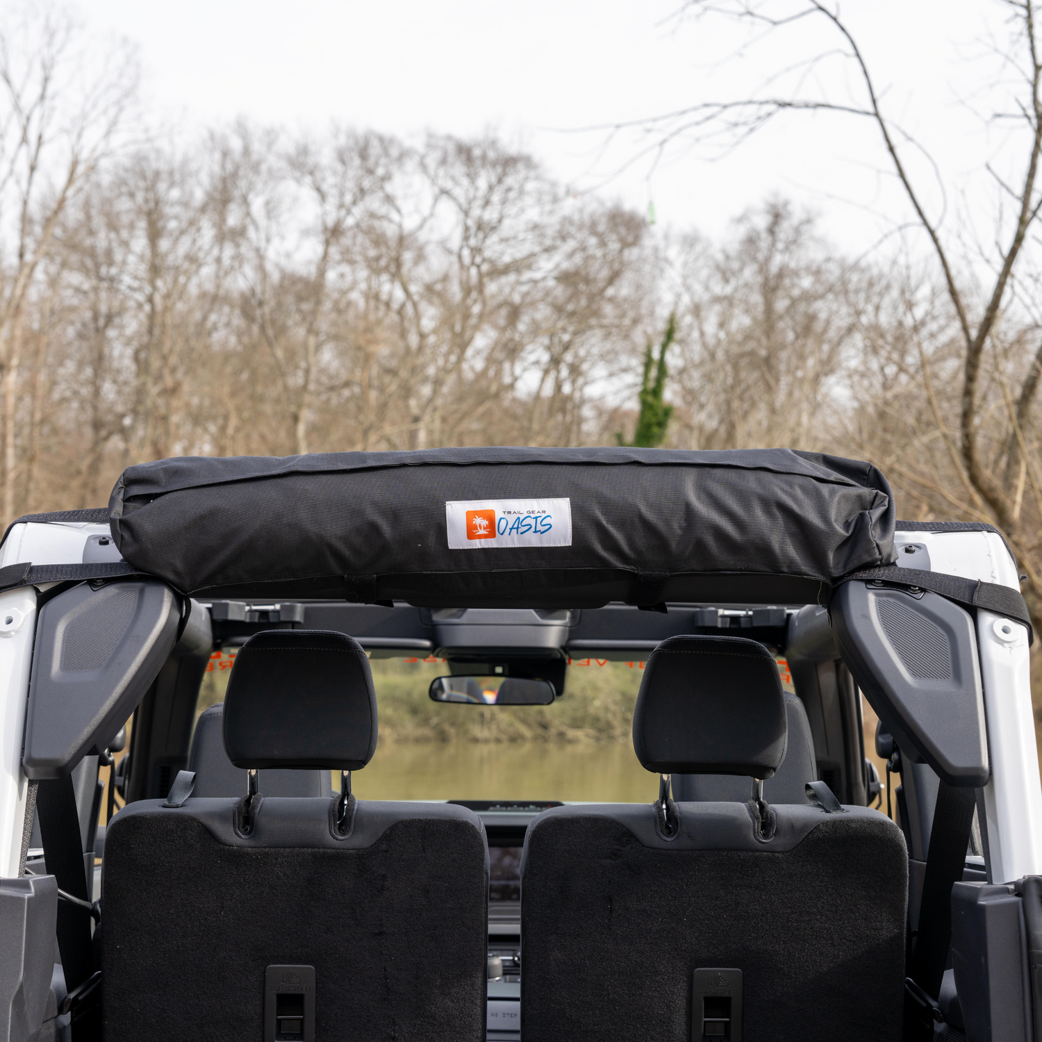 Trail Gear Oasis 2-in-1 Trail Cover & Sun Shade stored in roll bag on Bronco roll bar.
