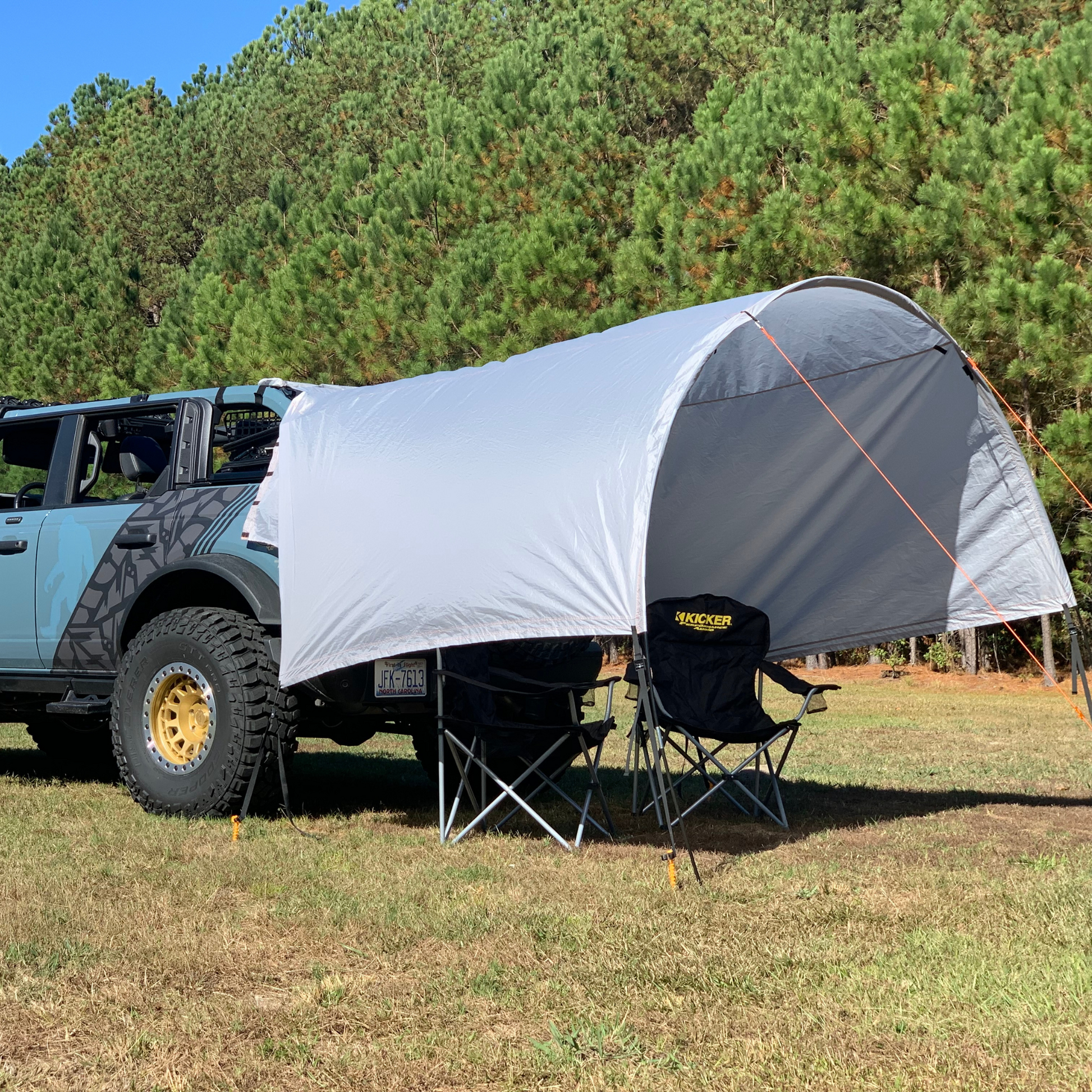 Ford Bronco with 2-in-1 Trail Cover and Sun Shade set up for camping