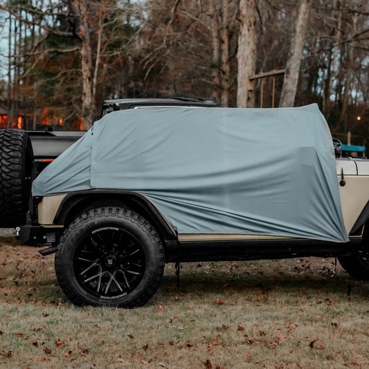 Trail Gear Oasis 2 in 1 Jeep Trail Cover and Sun Shade fully covering a Jeep Wrangler