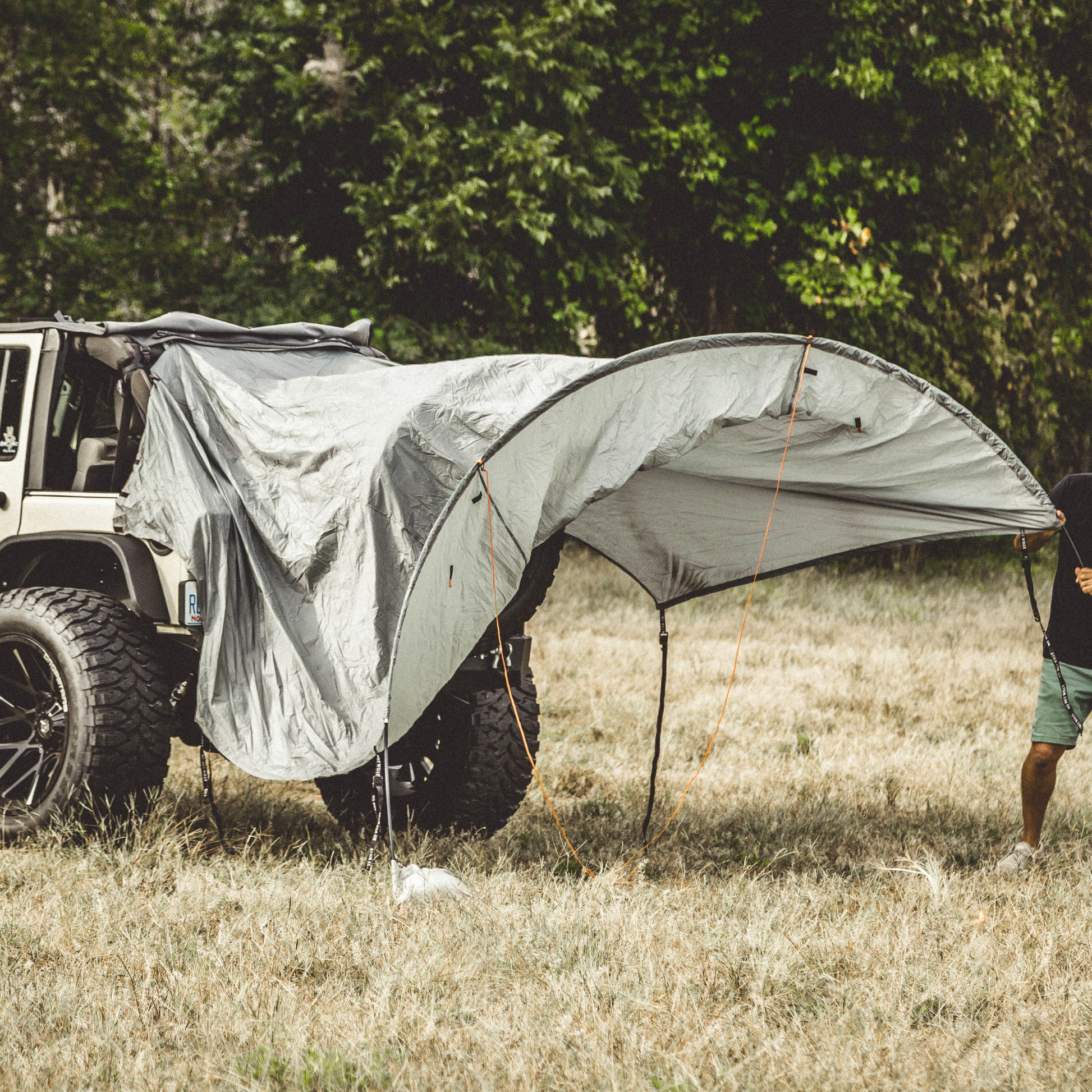 Trail Gear Oasis Jeep Trail Cover and Sun Shade being set up with poles extended