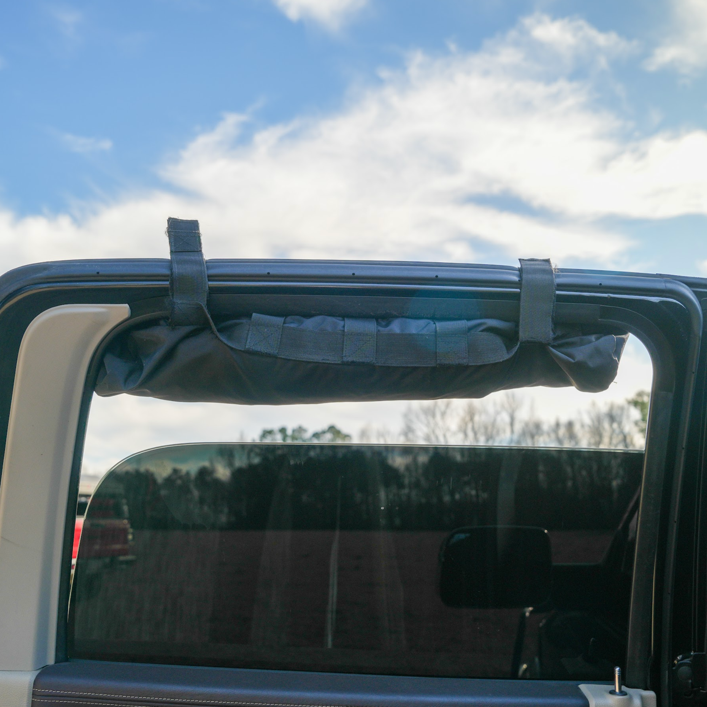 Trail Gear Oasis rear glass mounting strap secured to truck rear window frame for sun shade attachment