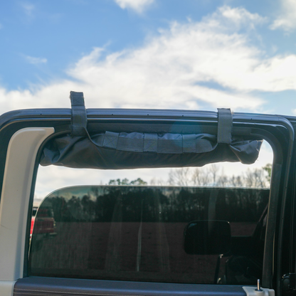 Trail Gear Oasis rear glass mounting strap secured to truck rear window frame for sun shade attachment